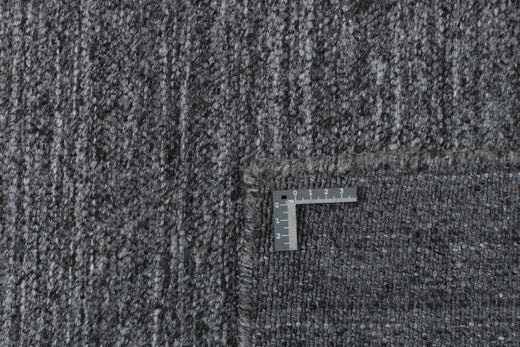 Laagpolig vloerkleed MOMO Rugs Nouveau Plain Dark Grey Vloerkledenwinkel